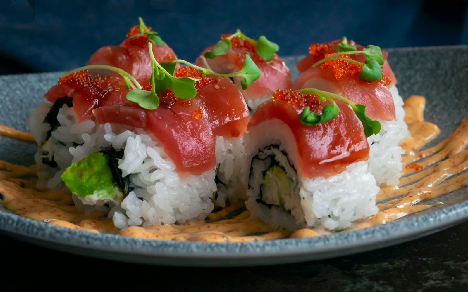 Tuna-topped sushi roll with spicy mayo and microgreens at Haiku Sushi, Lozenets