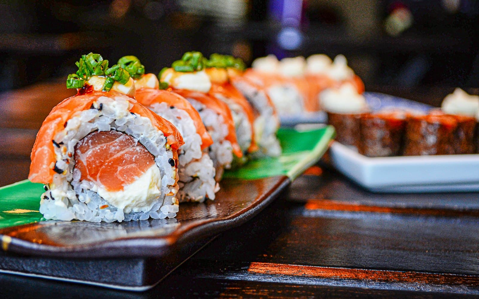 Salmon-topped uramaki rolls with chives at Sasaguri Sushi Bar, Sofia